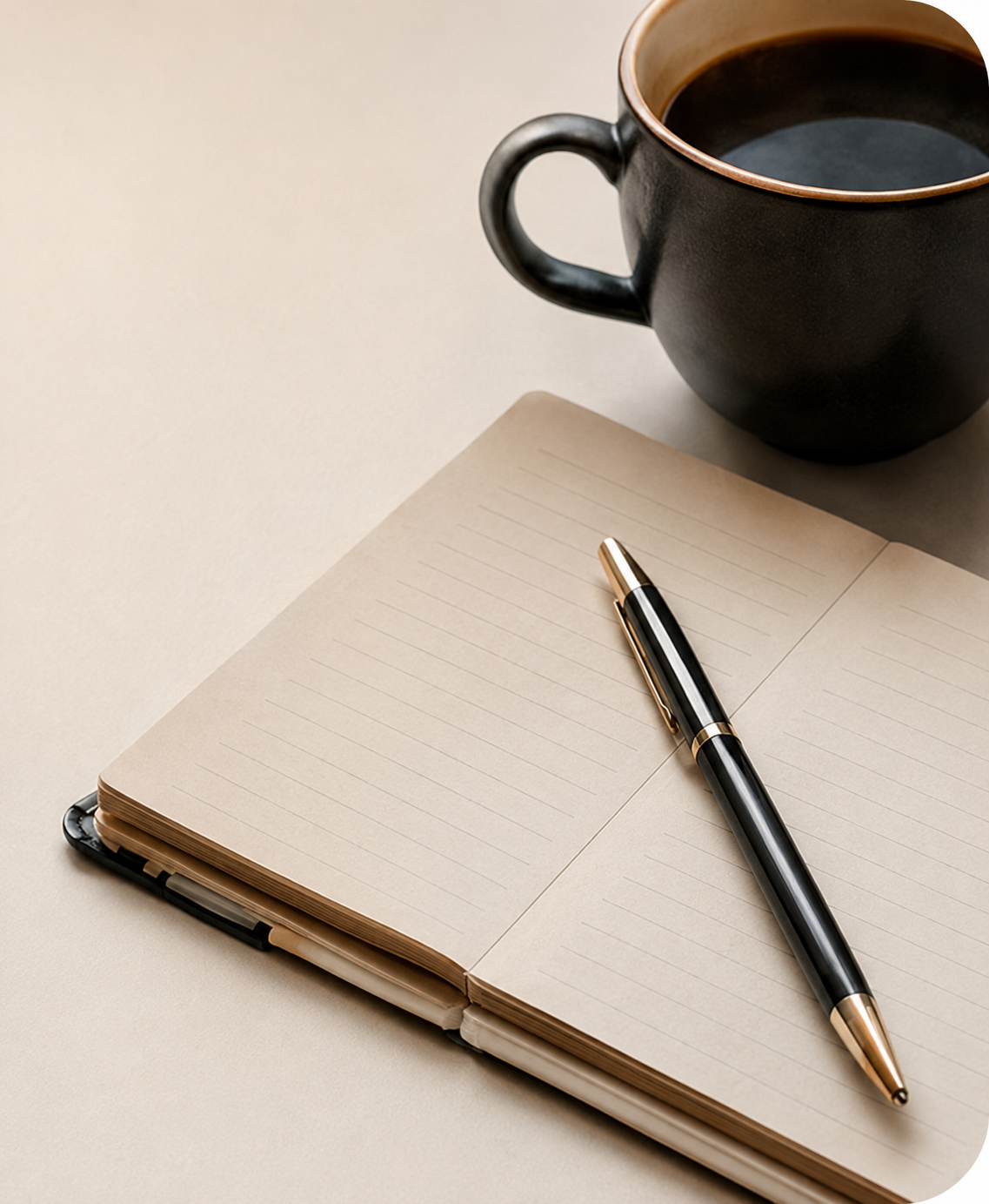Notebook, pen, and coffee on Jody's writing desk