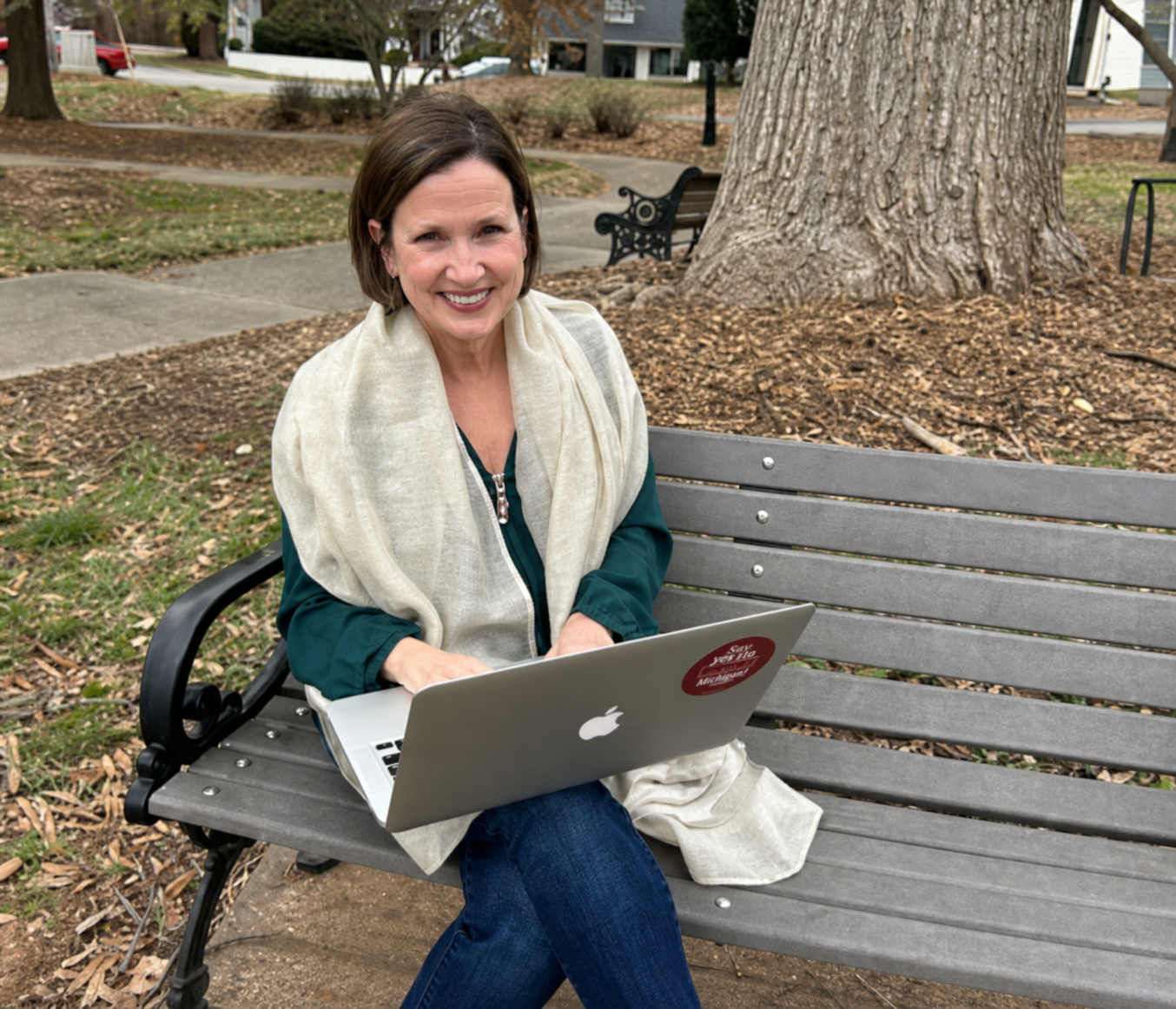 Jody Cauthen working on a laptop in the park